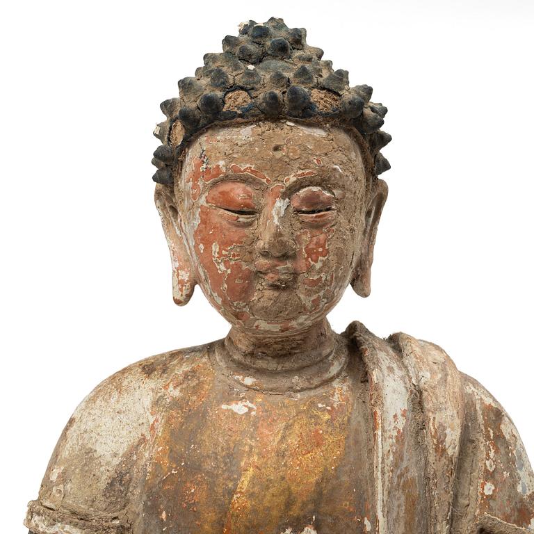 A Southeast Asian figure of a Buddha, 20th century.