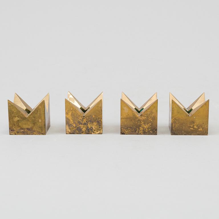 A set of four brass 'Kronan' candlesticks by Pierre Forsell, Skultuna.