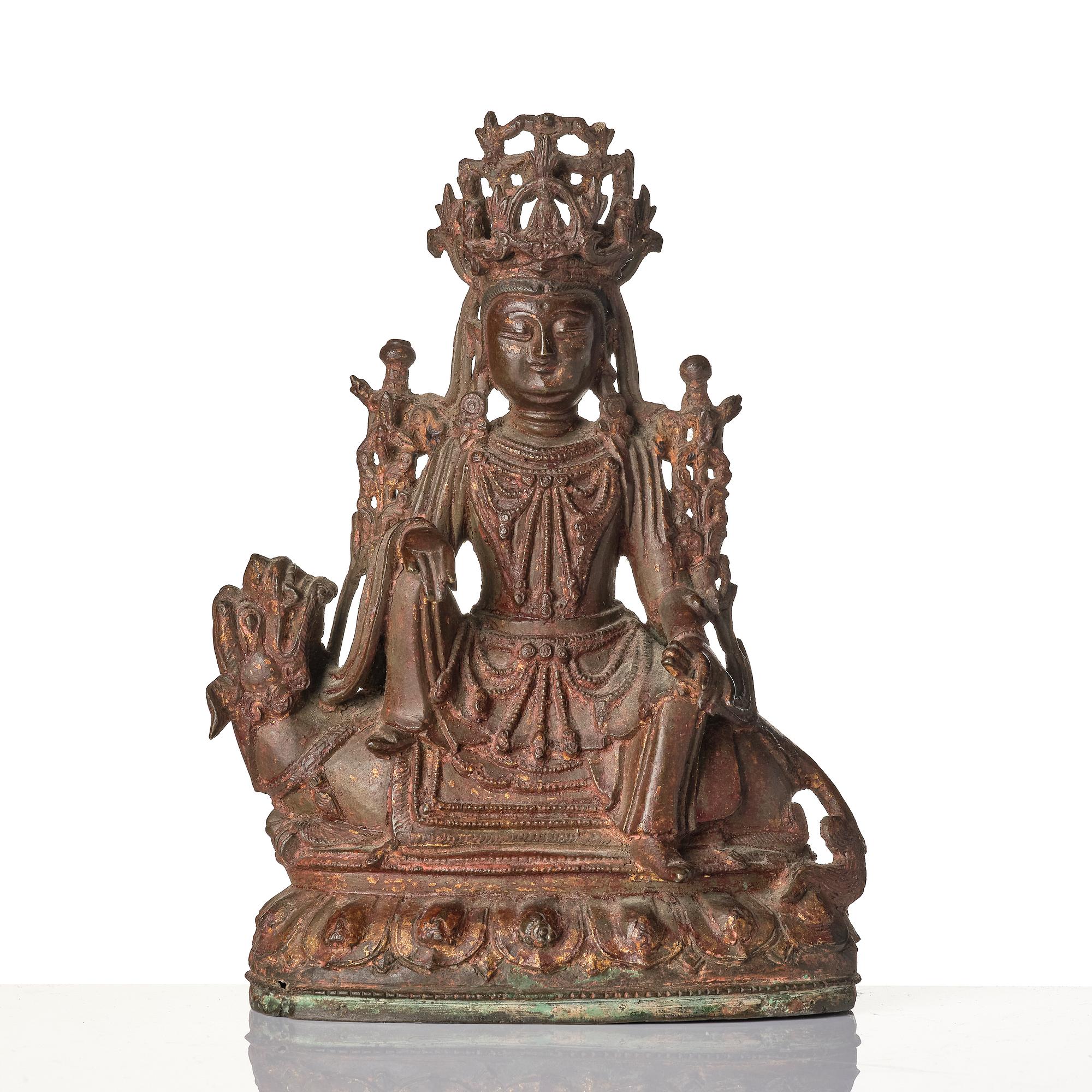 A Chinese bonrze figure of a Budha, probably late Ming dynasty 17th century.