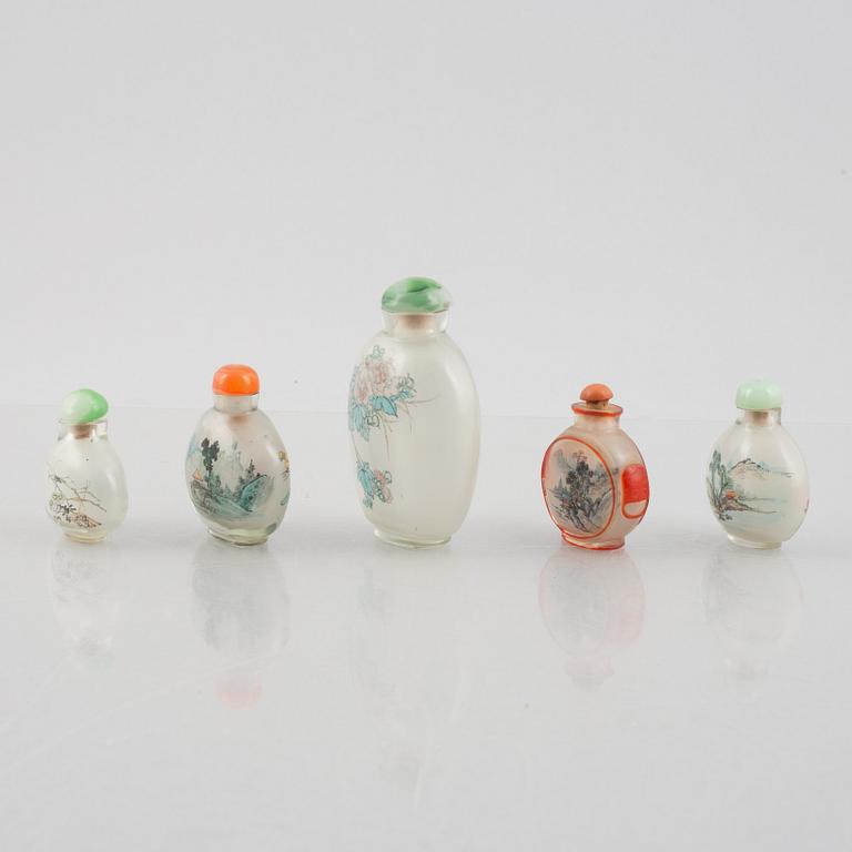 A group of nine Chinese glass and porcelain snuffbottles, 20th century.