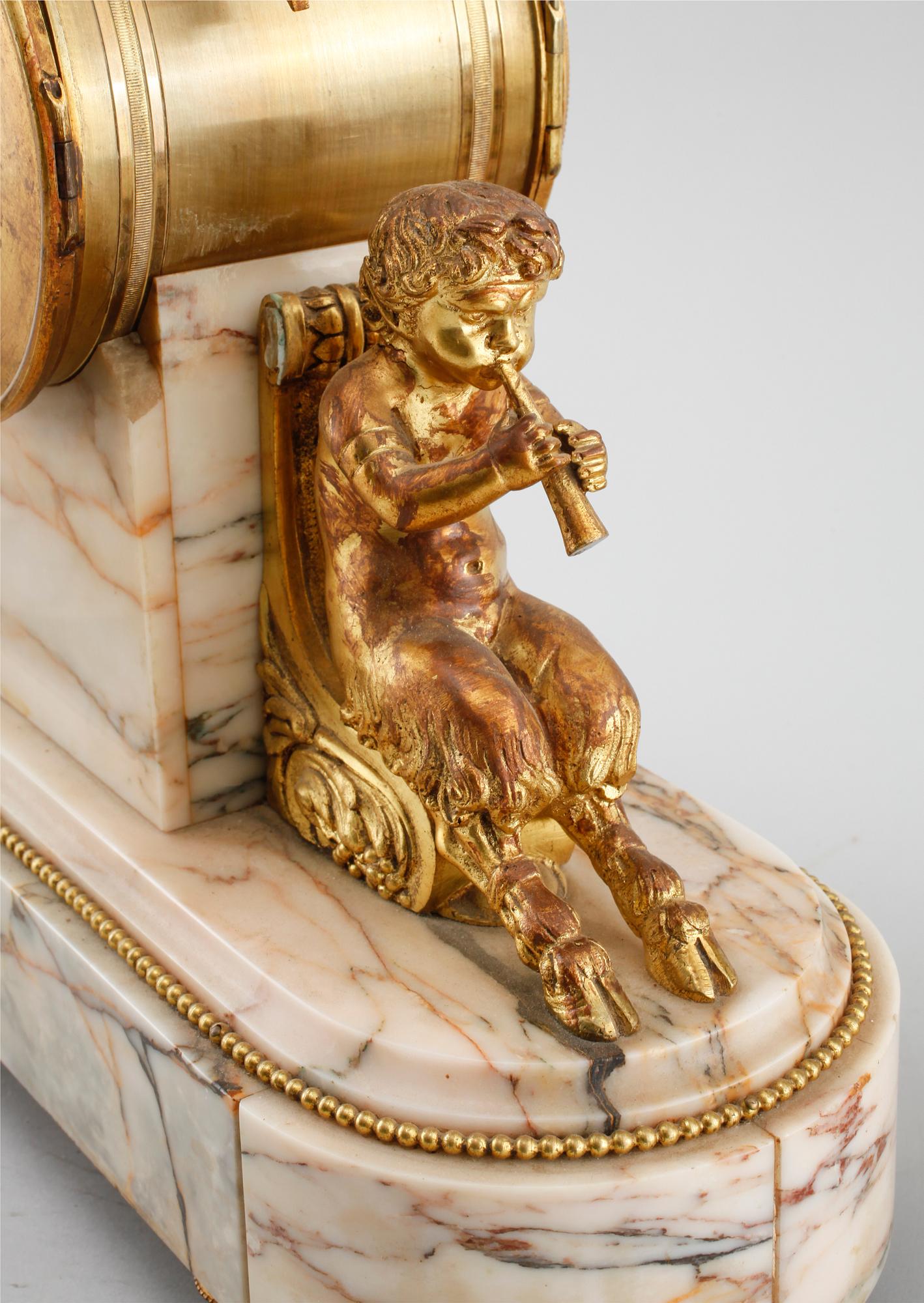 A table clock and two decoratives urn, around year 1900.