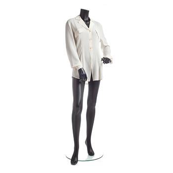 GIORGIO ARMANI, a light beige silk blouse.