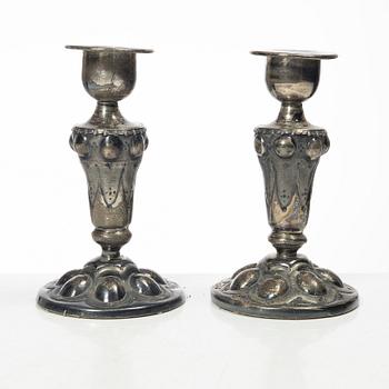 Four pairs och Swedish silver candlesticks, 19th-20th century.