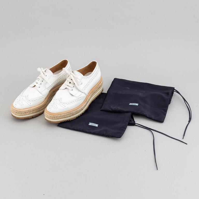 Prada, a pair of white leather brogues, size 36.