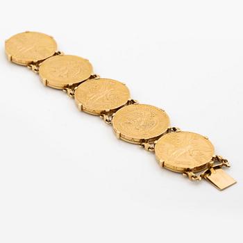 A bracelet gold set with mexican gold coins.