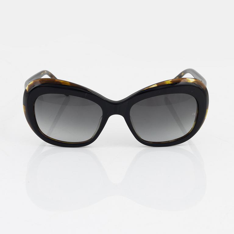 Oliver Goldsmith, a pair of sunglasses.