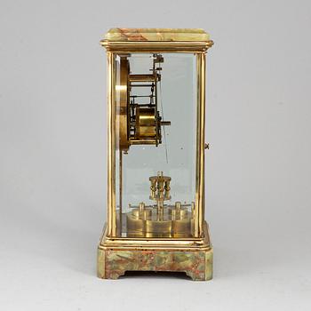 A French onyx and brass mantel clock, first half of the 20th century.