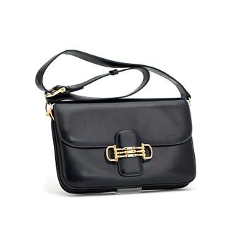 715. CÉLINE, a dark blue leather shoulder bag.