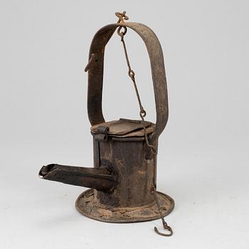 A 19th century tinplate oil lamp.