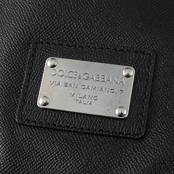 Dolce & Gabbana, a black leather weekend bag.