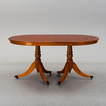 A late 20th century English style dining table and six chairs.