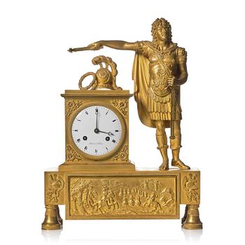 137. A French Empire figural ormolu mantel clock, early 19th century.