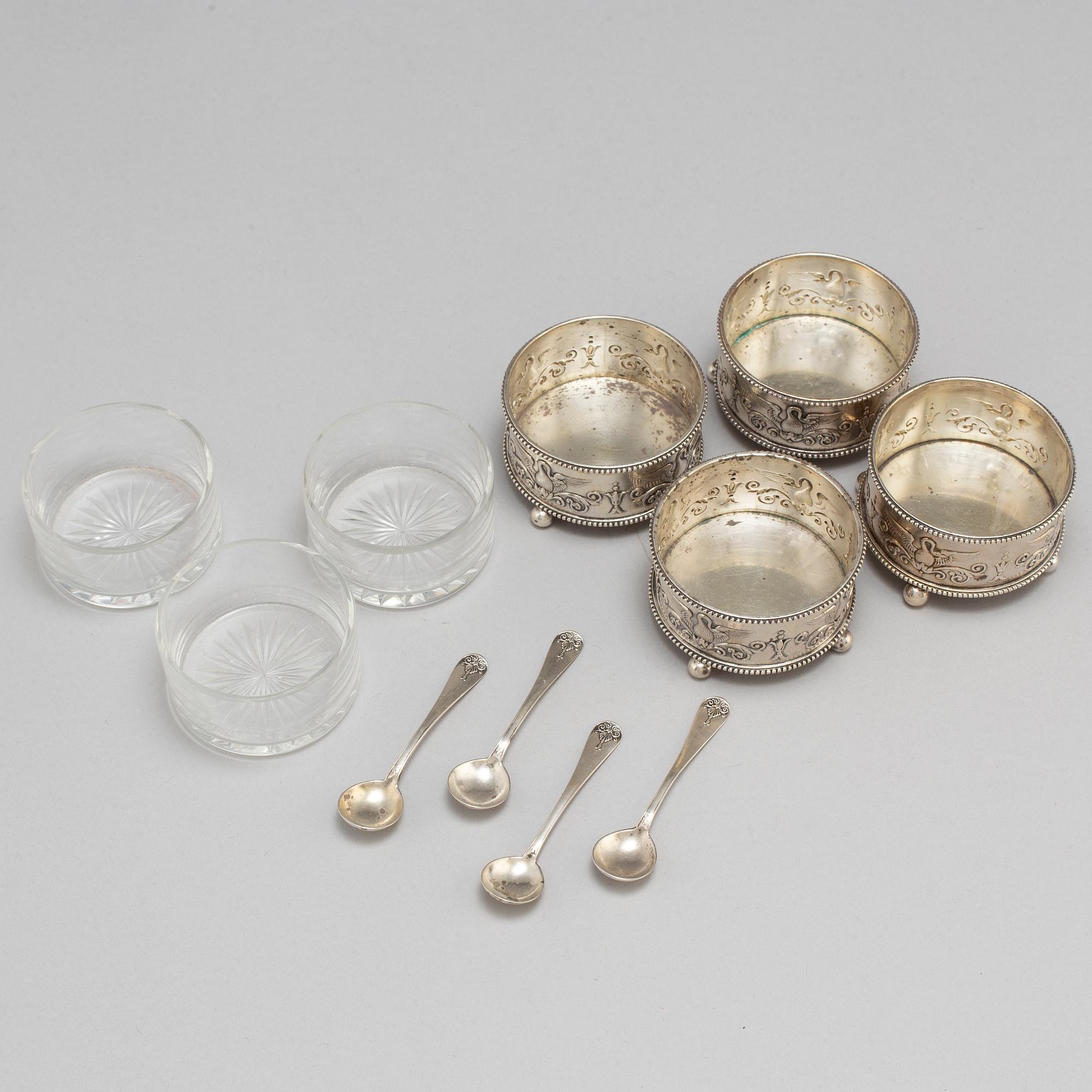 A set of four Fabergé salt-cellars and spoons, marked Moscow 1908-1917. Imperial Warrant.