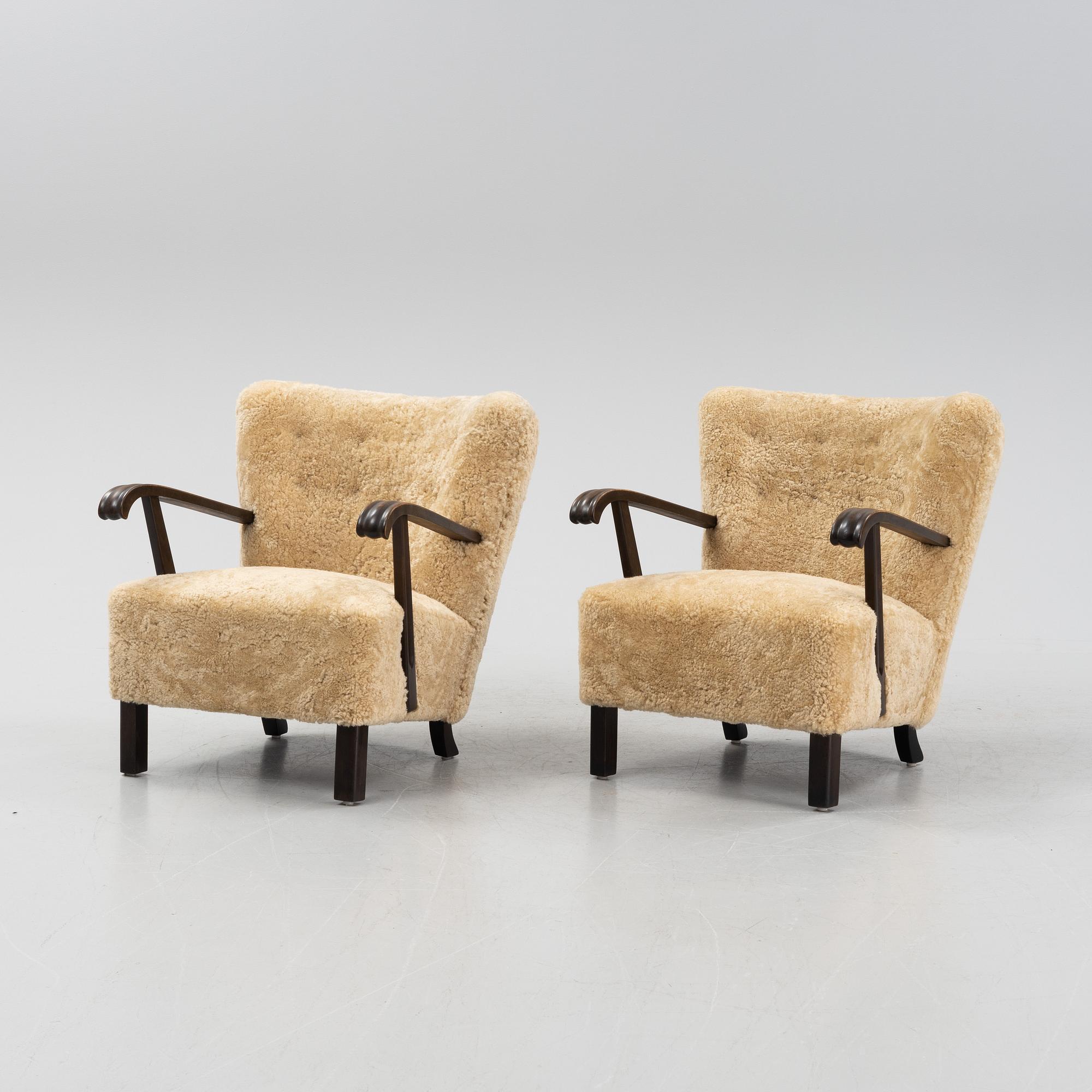 A pair of lounge chairs with new sheepskin upholstery, Denmark, 1930's/40's.