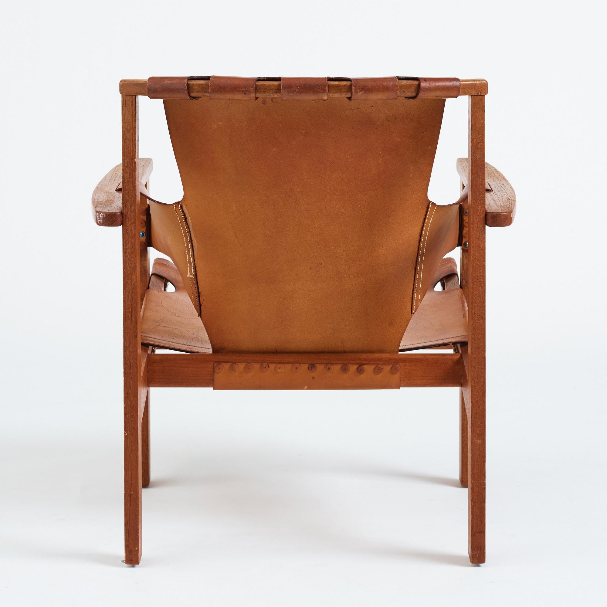 Carl-Axel Acking, a "Trienna" oak and natural leather easy chair, for Nordiska Kompaniet, Sweden 1960's.