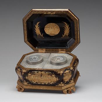 A lacquered tea box with pewter canisters, Qing dynasty, late 19th Century.