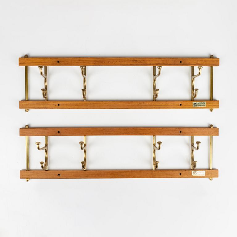 A pair of 'Dekorativ' teak coat hangers, Skoglunds metallgjuteri, Anderstorp, 1950's/60's.