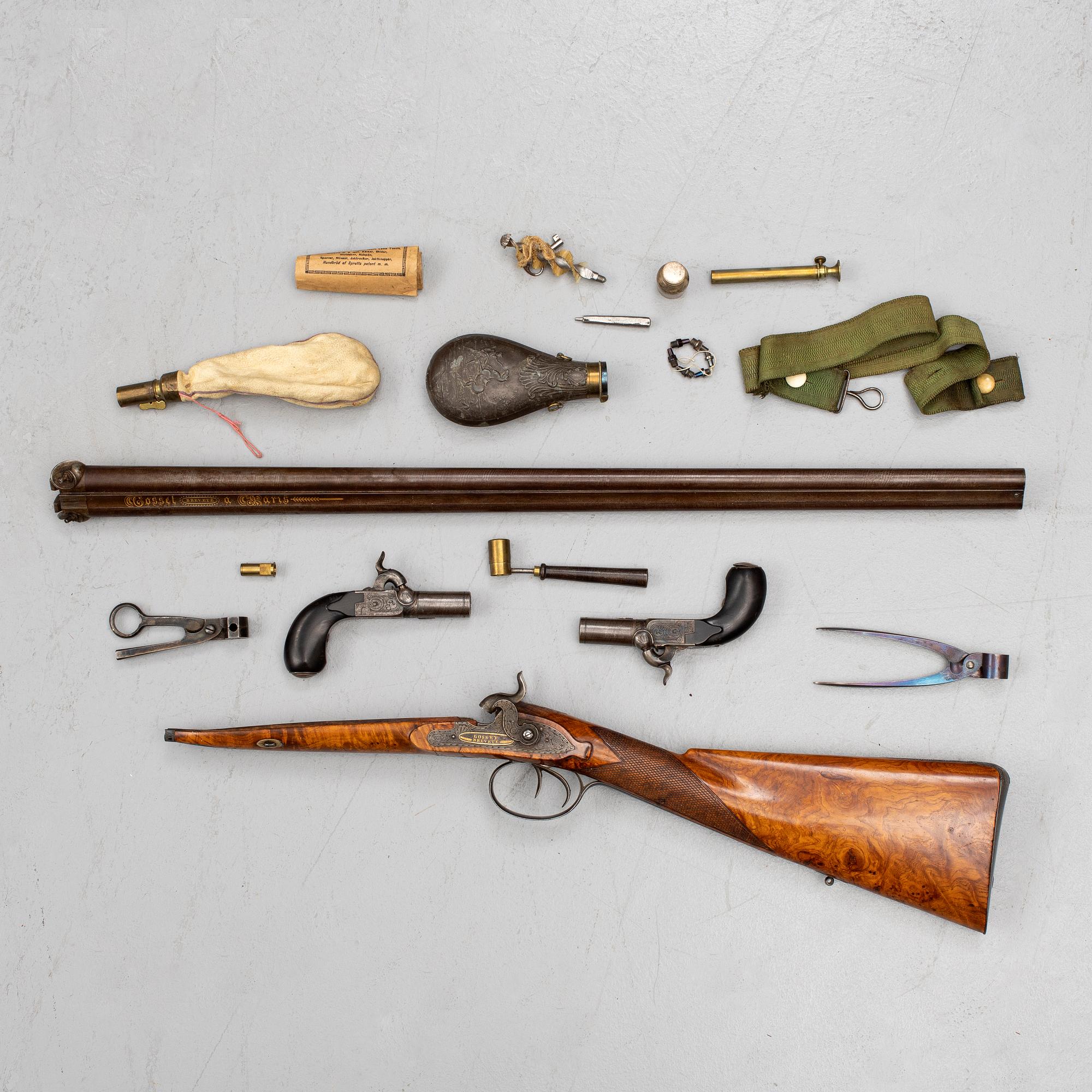 A cased double barreled percussion shotgun marked Gosset a Paris and a pair of percussion pistols marked Fni PAR LEPAGE.