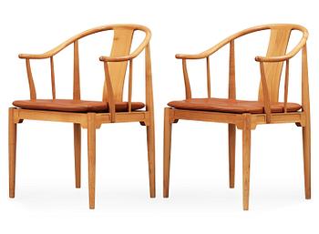 79. A pair of Hans J Wegner cherry and brown leather 'China chairs', Fritz Hansen, Denmark 1988-89.