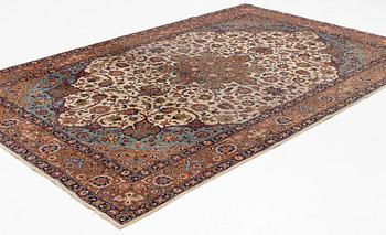 A semi-antique Tabriz carpet, 361 x 235 cm.