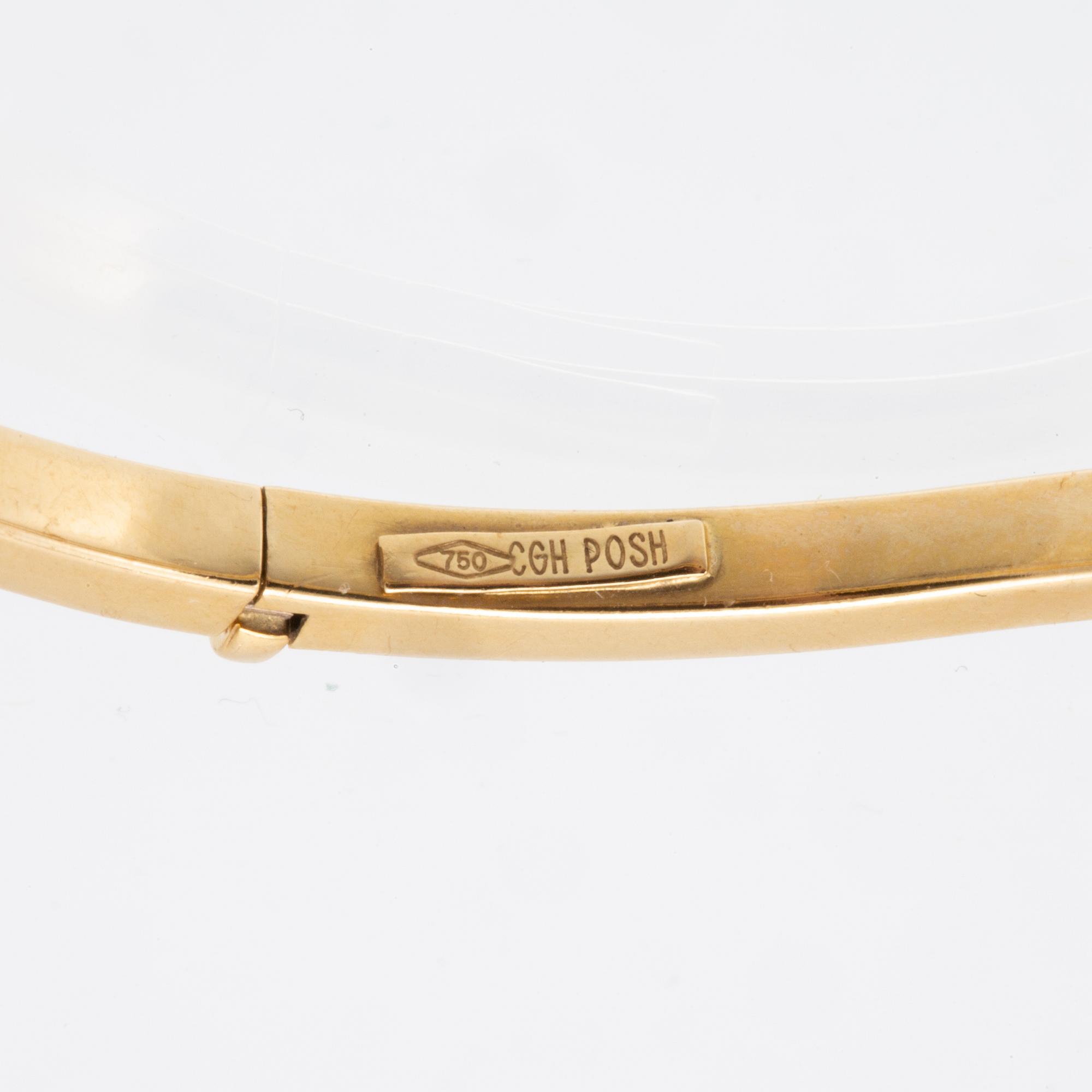 An 18K gold bracelet.