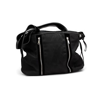 689. YVES SAINT LAURENT, a black fabric tote with leather details.