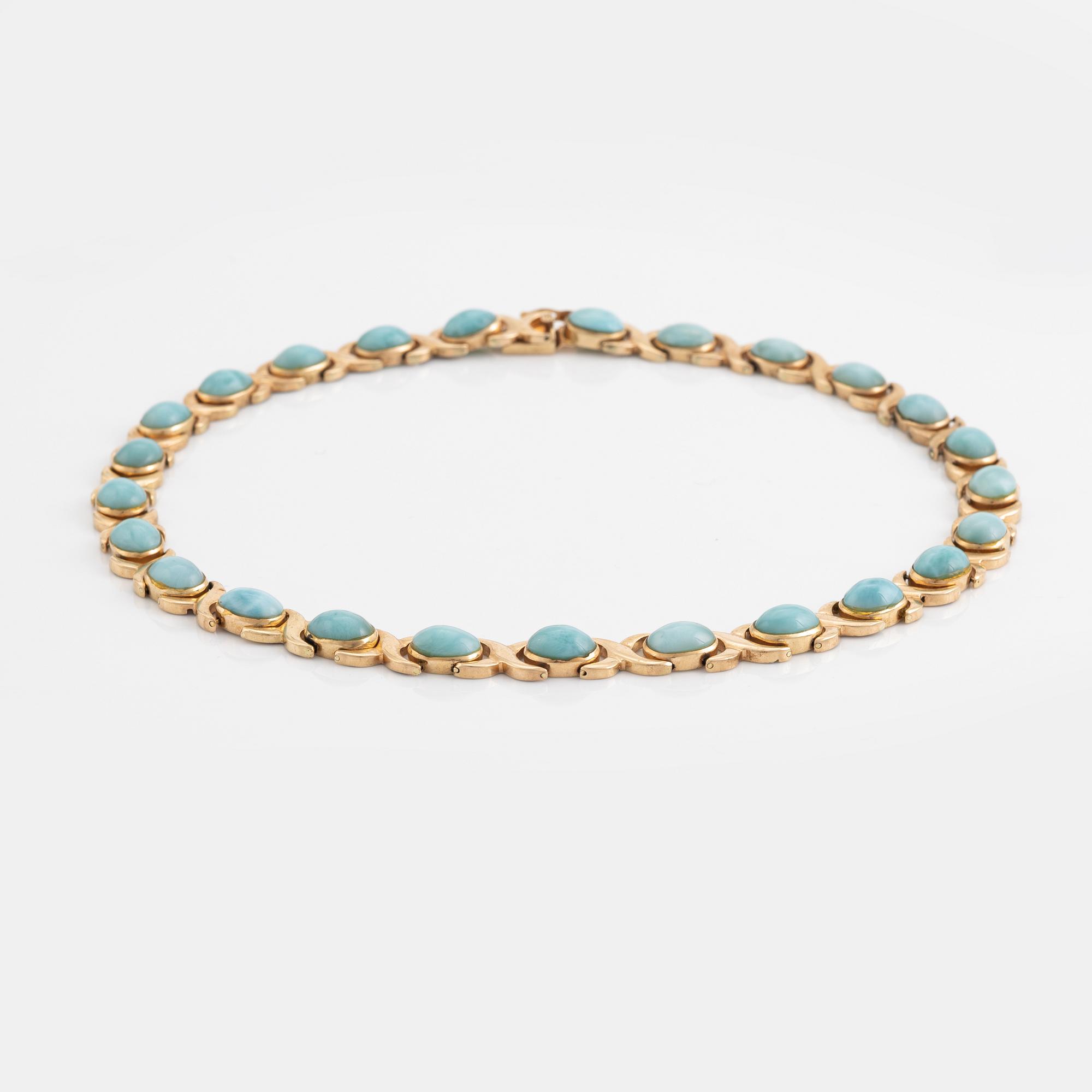 14K gold necklace and ring, with cabochon cut blue stones.