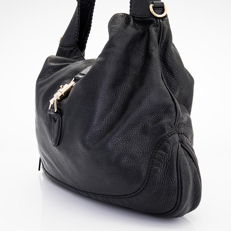 Gucci, a 'Bamboo Jackie Tassel' shoulder bag.