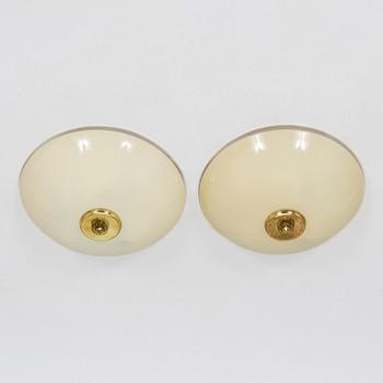 A pair of mid-20th century 'EA 72 ceiling lights for Itsu.