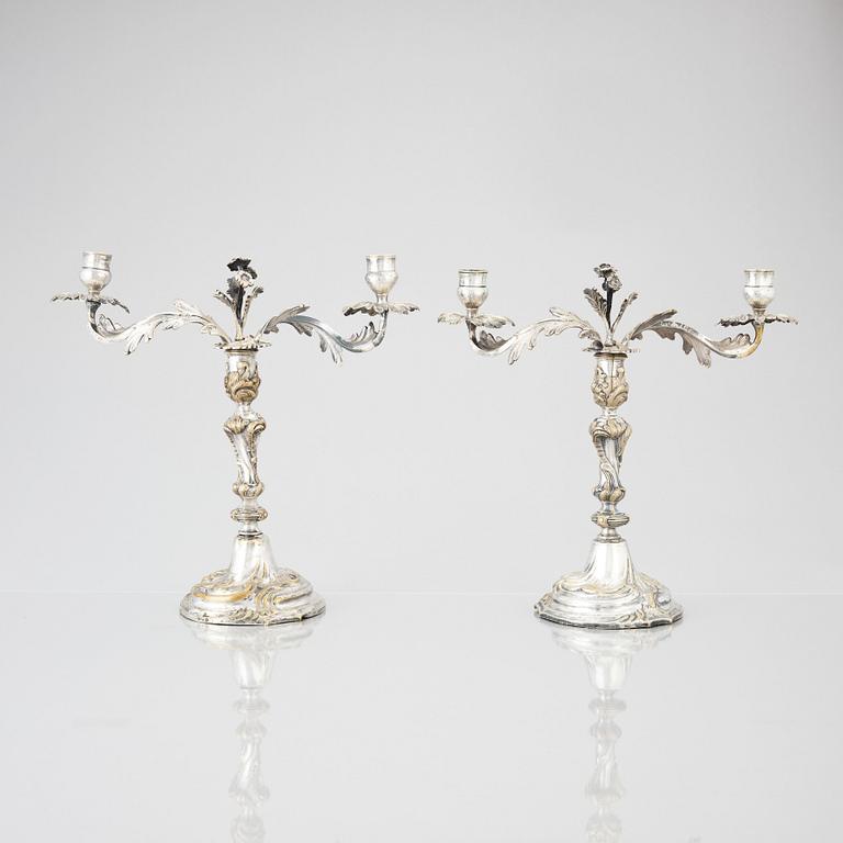 A pair of Swedish Rococo argent haché candelabra.