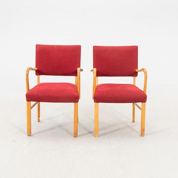 A pair of 1940s armchairs.