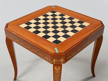 A gaming table and two chairs from Italy, 1950s.