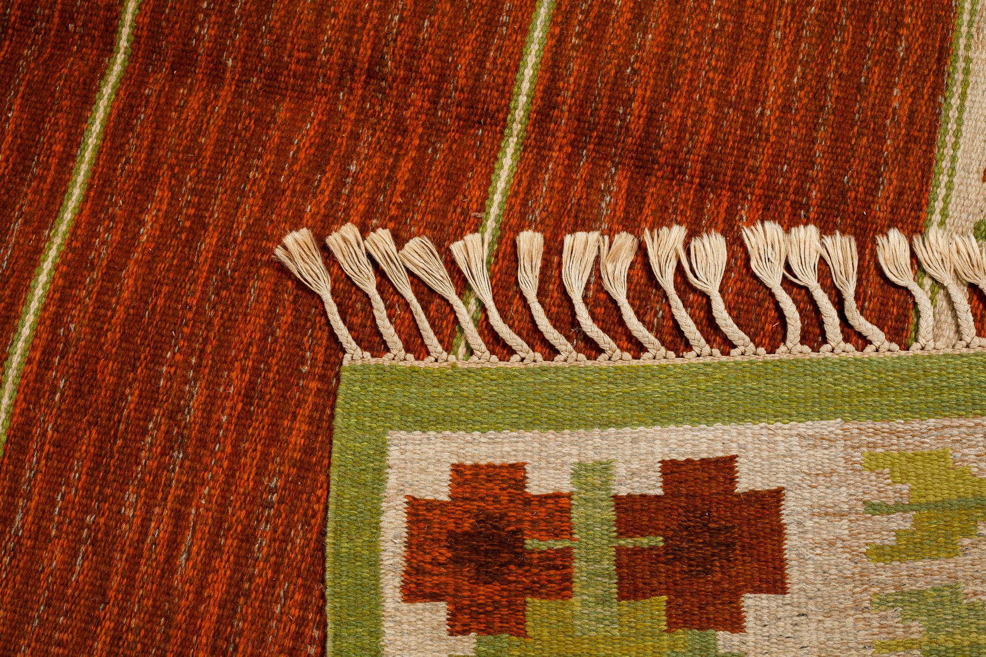 A flat weave by Berit Woelfer, signed BW, third quarter of the 20th century, 238 x 197 cm.