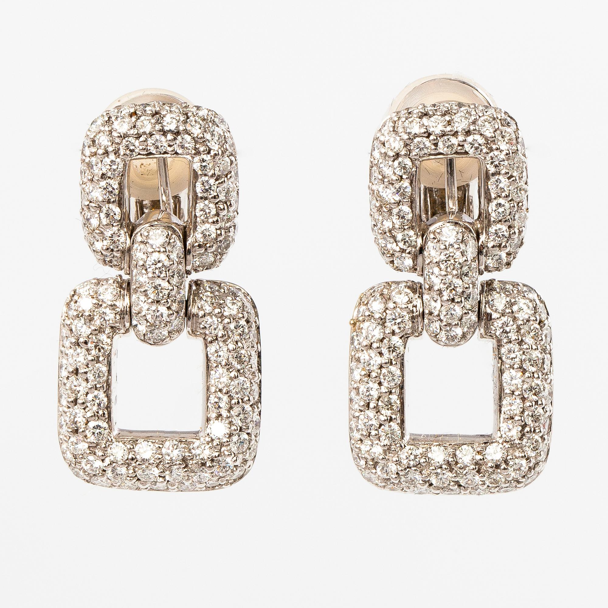 A pair of 18K white gold earrings with 230 brilliant cut diamonds, ca. 4.07 ct in total.