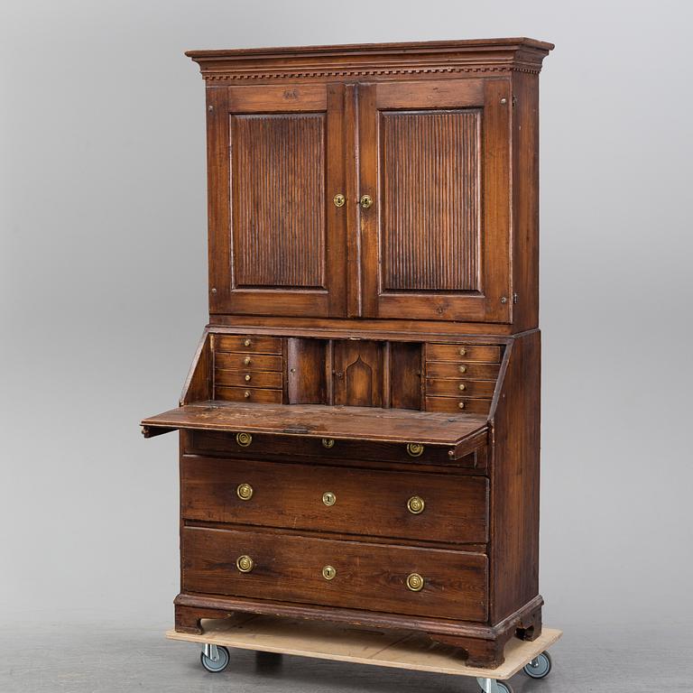 An early 19th Century pine cabinet.