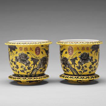 A pair of yellow glazed Dayazhai mark flower pots with stands, Republic, 20th Century.