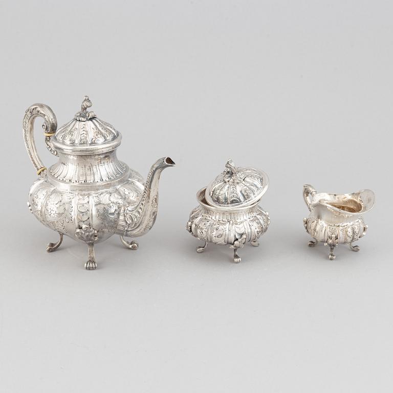 A silver teapot, creamer and sugar bowl, swedish import mark.