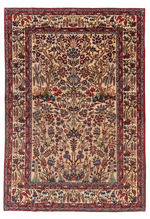 A semi-antique Qum carpet, Central Persia, c. 312 x 215 cm.