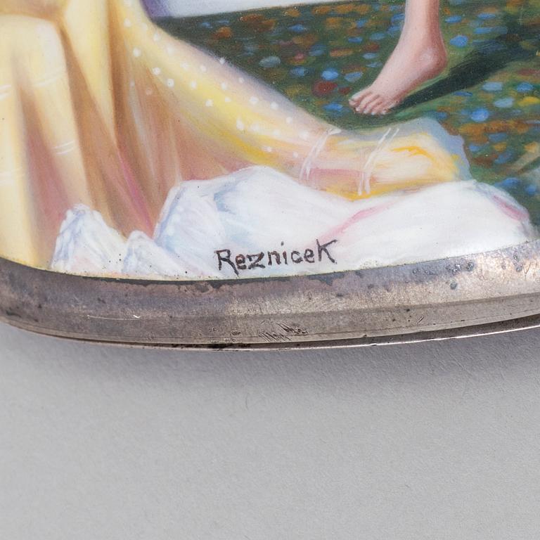 A 935/1000 silver and enamel cigarette case, with signature 'RezniceK'.