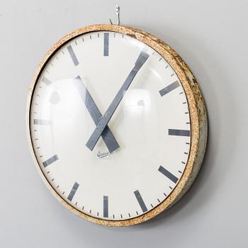 A METAL FRAMED WALL CLOCK, dial marked LM Ericsson, second half of the 20th century.