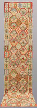 A runner kilim, ca 391 x 88 cm.