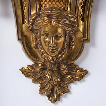 A French  Louis XVI-style wall clock, around 1900.