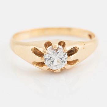 Ring, with faceted white stone.