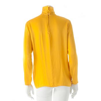 GUY LAROCHE, a yellow silk blouse.