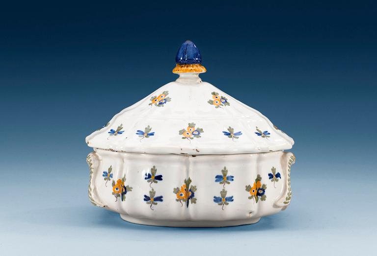 A French faience tureen with cover, 18th Century.