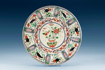 A Japanese imari dish, 1660/80's. Decorated in the style of late Ming 'kraak' porcelain.