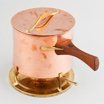 A copper pot with rechaud by Jens Quistgaard, third quarter of the 20th century.