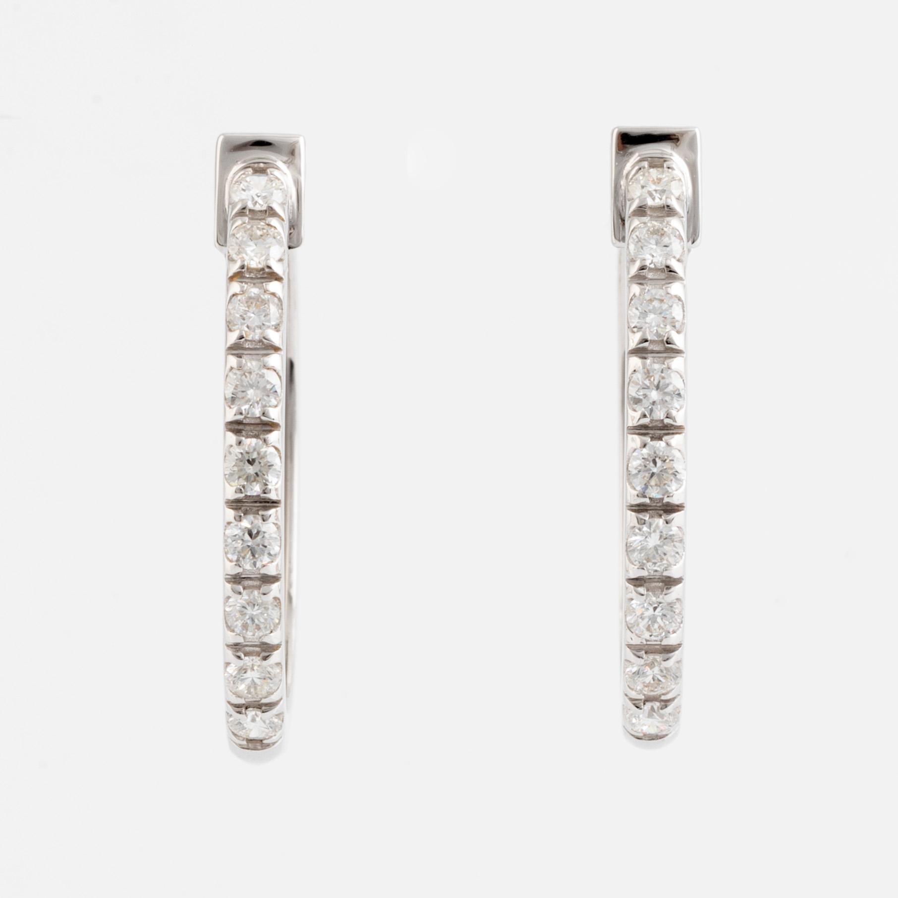 Brilliant cut diamond hoop earrings.