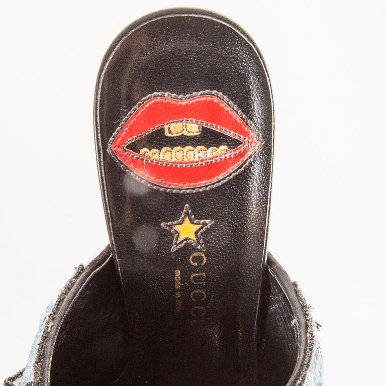 Gucci,.