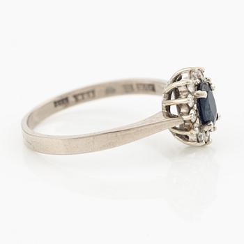 Ring, 18K white gold with sapphire and octagon-cut diamonds.